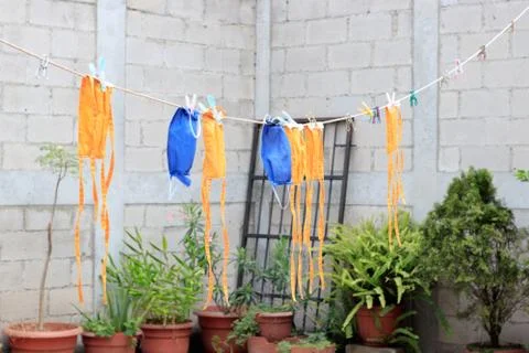 Face masks drying at the sun Foto stock