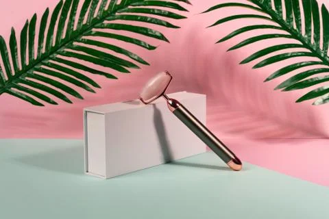 Face massage device scraper vibrating device for beautiful skin Stock Photos