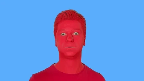 The face of men painted with red paint Stock Footage 107849051