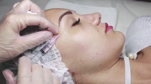 Face mesotherapy procedure in a beauty salon. Stock Footage