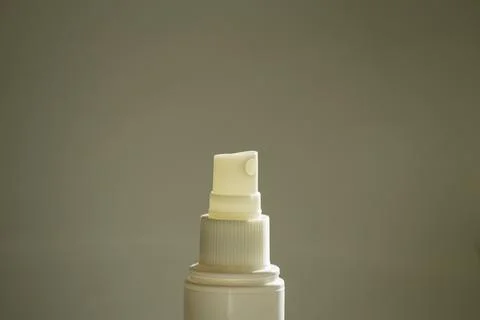 Face mist bottle on gray background Stock Photos