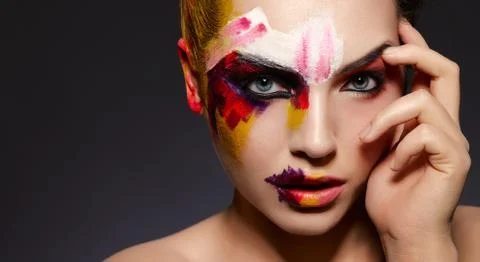 Face of model with bright art makeup Stock Photos