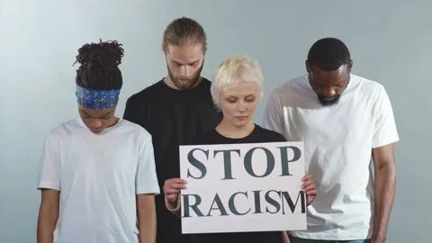 Face Multi-ethnic people protesting for equal rights hold poster Stop racism Stock Footage 133641884
