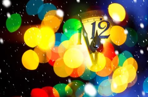 Face of new year clock with colored decoration Stock Photos