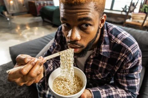 Face of a nice bearded man while eating Stock Photos