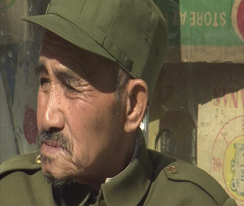 Face of older man wearing olive colored army uniform Stock Footage 86745287