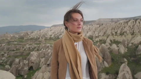 Face in the open air portrait of a young female traveler with a direct look into Stock Footage 205857636
