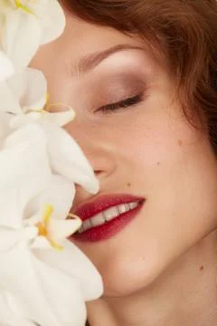 Face with orchids Foto stock