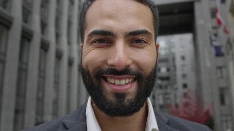 Face Of An Oriental Man. He Stands On The Street And Smiles. Video stock 144432013