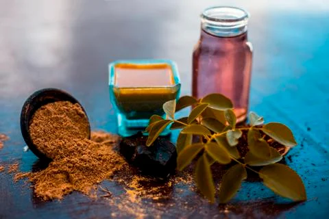 Face pack of devil's dung powder on wooden surface i.e. Hing powder well mixe Stock Photos
