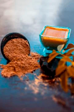 Face pack of devil's dung powder on wooden surface i.e. Hing powder well mixe Stock Photos