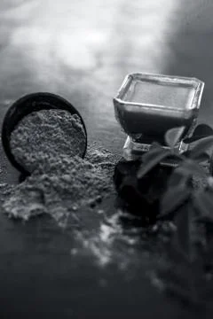 Face pack of devil's dung powder on wooden surface i.e. Hing powder well mixe Stock Photos