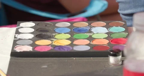 Face paint close up of paint colors Stock Footage 166326857