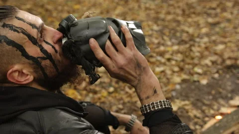 Face paint, rugged man, forest drink Stock Footage 306238485