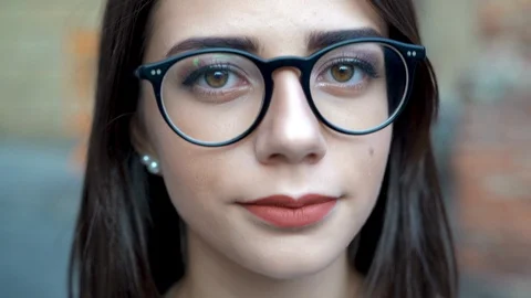 Face portrait close up, beautiful young girl looking at camera Video stock 115593723