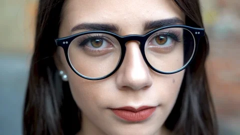 Face portrait close up, beautiful young girl looking at camera Stock Footage 115771378