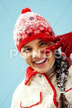 Face of pretty woman in gloves and knitted winter cap looking at camera with two Stock Photos