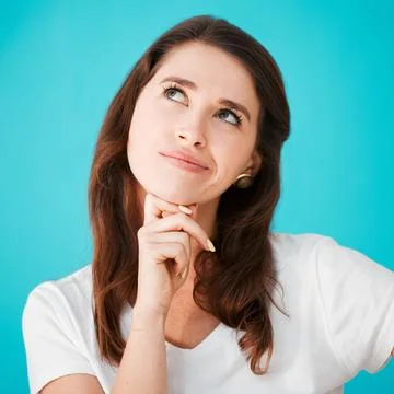 Face, problem solving and thinking with woman on blue background for idea Stock Photos