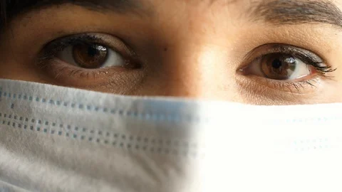 Face in a protective mask, close-up of eyes looking at the camera Stock-Footage 129668060