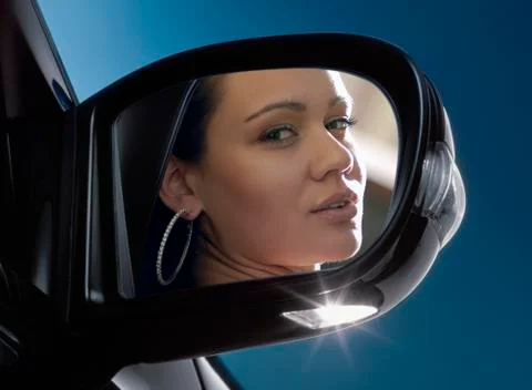 Face in rear-view mirror Stock Photos