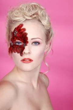 Face with red feathers Foto stock