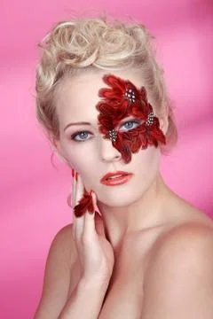 Face with red feathers Stock Photos