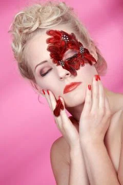 Face with red feathers Stock Photos