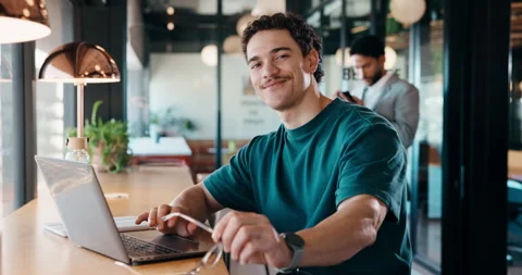 Face, remote work and man with laptop in cafe, glasses and confidence for Stock Footage 335858099