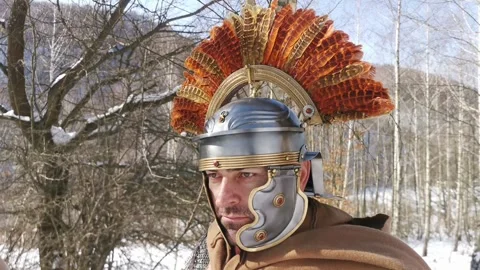 The face of a Roman centurion looking into the distance over the hostile lan Stock Footage 260119817
