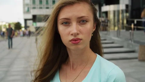 Face of sensual girl looking at camera on city street Stock Footage 91732553