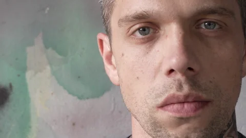 The face of a serious, strict man with blue eyes. Stock Footage 280176536