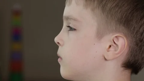 Face of a seven years old boy. Negative ... | Stock Video | Pond5