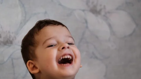 Face of a small smiling boy Stock Footage 127702583