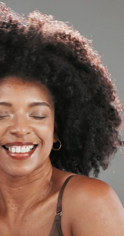 Face, smile and afro with black woman in studio for curl pattern, natural Stock Footage 333378499
