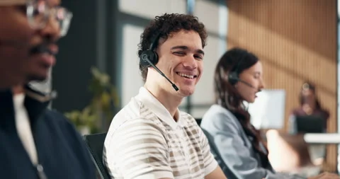 Face, smile or man in call center for help desk, technical support or laughing 動画素材 340602353