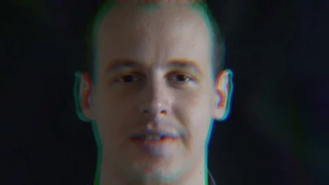 Face of a smiling man, a distorted random characters. Concept: a glitch in the Stock-Footage 76554638