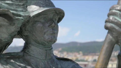 Face of a statue with a panel behind it with a change of focus Stock Footage 76952572