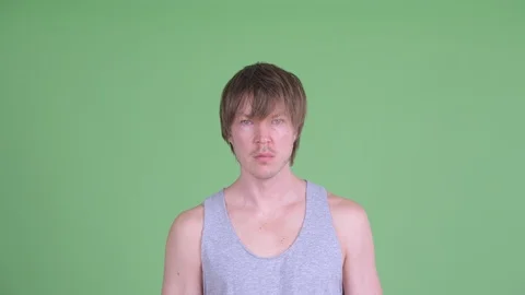 Face of stressed young man with messy hair showing face palm gesture Stock-Footage 117780640