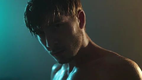 Face Of Strong Boxer In Dark Ring. Young Man Standing With Naked Torso. Piercing Stock Footage 160767048