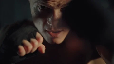 Face of strong boxer man is fighting in gym during training Video stock 98744278