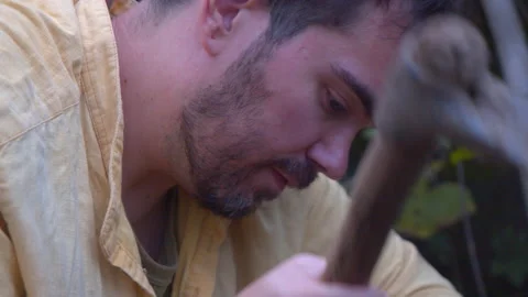Face of Struggling Bean Farmer Hoeing His Garden Shoveling Plants, Slow-Motion Stock Footage 169000558