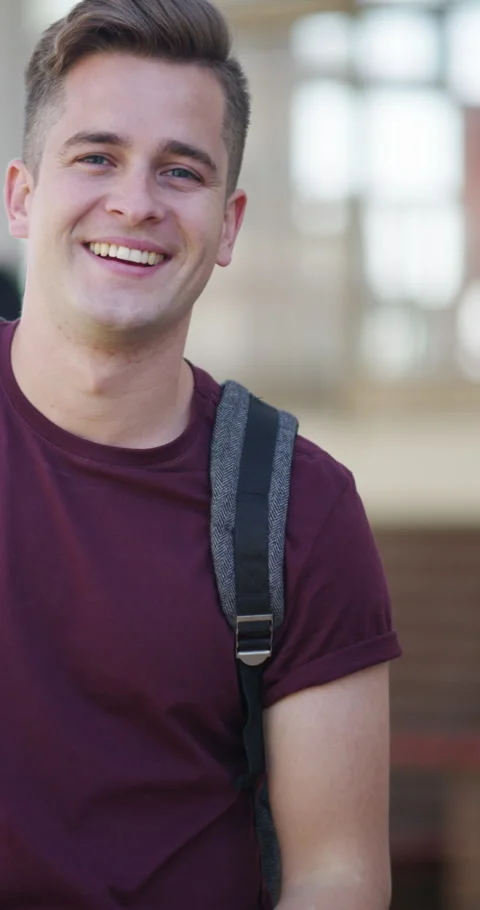 Face, student and happy man with mobile on campus, academic meme and funny Stock Footage 334938348