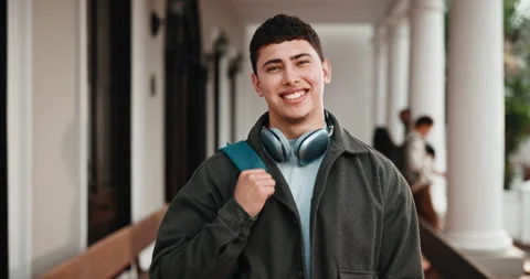 Face, student and man at college with backpack, headphones and higher education Stock Footage 346293142
