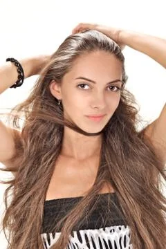 Face studio portrait of young pretty lady with long hairs on white Foto stock