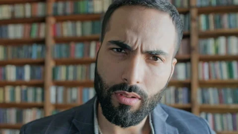 Face Of Stylish Young Man In The Library. Stock-Footage 140221063
