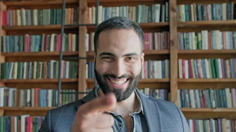 Face Of Stylish Young Man In The Library. Vídeos de archivo 140221176