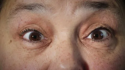 Face of surprised or shocked old Arab woman with brown eyes raising eyebrows. Stock Footage 167525136