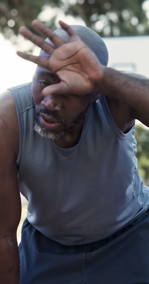 Face, sweat and man outdoor for basketball, practice and game with fatigue Stock Footage 340968731