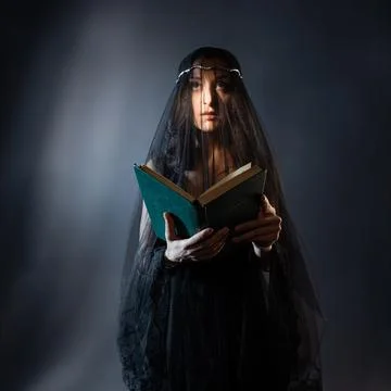 Face under a black veil, a young woman in black Stock Photos