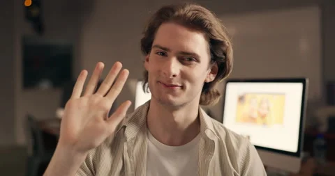 Face, video call and man waves in seminar for training, speaker with hello or Stock Footage 264578458